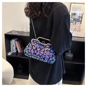 Detail of evening clutch bag featuring purple mosaic stones and silver metal chain