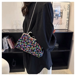 Detail of colorful sequin shell evening bag with silver kiss-lock and metal chain strap