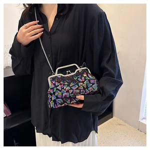 Detail of colorful geometric sequin clutch with metal chain strap and beads clasp