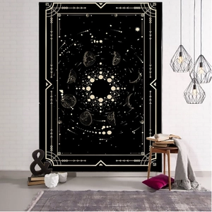 Close-up of Nordic tarot tapestry featuring golden celestial moon phases and sun patterns
