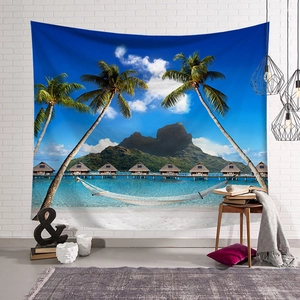 Tropical coconut tree tapestry hanging on a white brick wall in a cozy room