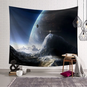 Detail of starry space tapestry with planet and snowy mountains on white brick wall