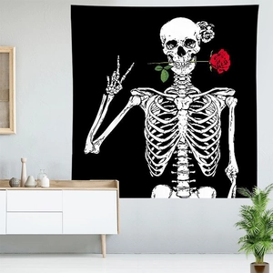 Gothic skull wall tapestry with red rose in hand on modern home interior background