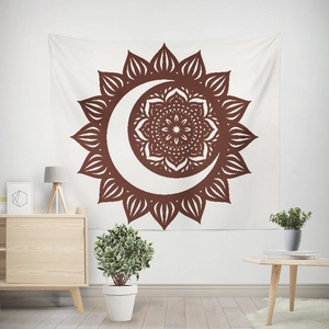 Bohemian moon and sun mandala tapestry hanging on white wall in a minimalist room