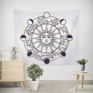 Detail of sun and moon phases wall tapestry in a minimalist living room interior