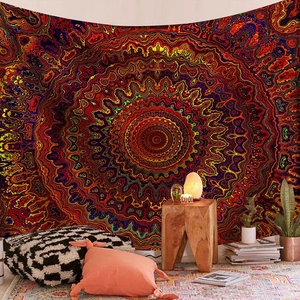 Detailed view of large mandala tapestry hung as a bohemian style wall decoration