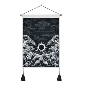 Japanese wave wall tapestry with sun and clouds design, hanging on a black wooden pole