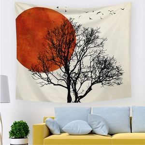 Detail of sunrise tapestry texture showing sun, tree and bird on wall above yellow sofa