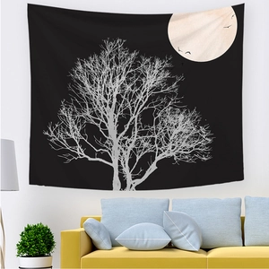 Detail of sunrise landscape wall tapestry featuring a zen black and white tree and moon design