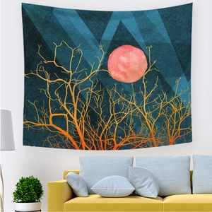 Abstract sunrise wall tapestry with moon and tree design above a cozy yellow sofa