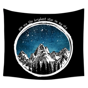 Detail of mountain forest tapestry with starry sky and inspirational English text
