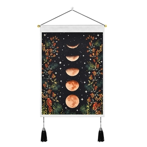 Phases of the moon wall tapestry with floral accents and decorative hanging tassels
