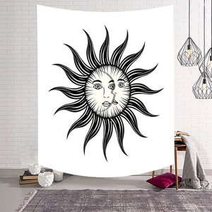 Bohemian sun and moon tapestry wall hanging for home decor on a white brick wall