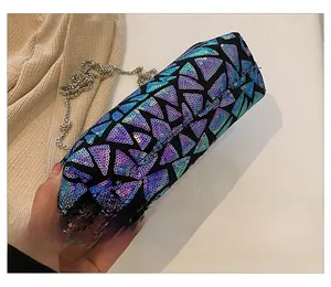 Close-up of the sequined shell bag bottom with shimmering purple and blue patterns