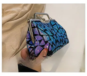 Detail shot of blue and purple laser sequins on a shell bag with silver metal frame