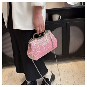 Pink sequin evening clutch bag with elegant top handle and detachable silver chain strap