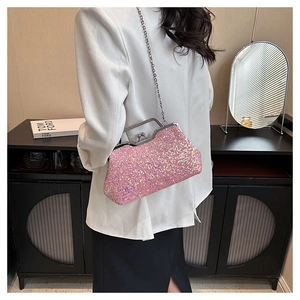 Detail of pink sequin evening bag with metal chain and vintage clasp closure