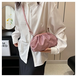 Detail of pink rhinestone cloud bag with ruched texture and slim crossbody strap
