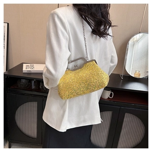Close-up of bright yellow sequin evening clutch bag with vintage metal clasp and chain