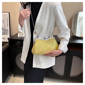 Close-up of sparkling yellow sequin evening clutch bag with silver kiss-lock and chain strap