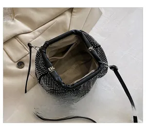 Interior view of black rhinestone cloud bag showing spacious storage and zipper pocket