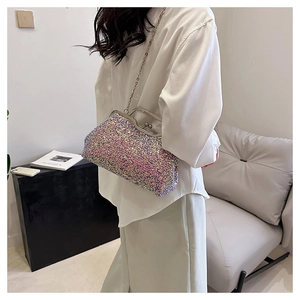 Sparkly sequin evening clutch bag shown on model for size and style perspective