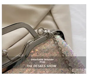 Detail of sequined evening clutch showing silver metal handle and detachable chain strap