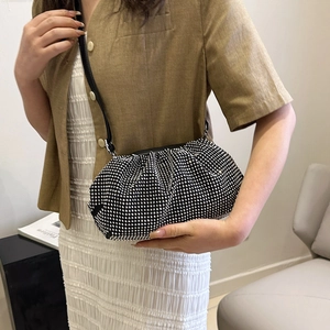 Elegant black pleated cloud bag with sparkling rhinestones and a leather shoulder strap