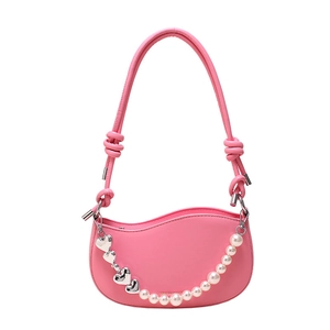 Pink hobo bag with pearl and silver heart chain strap on a white background