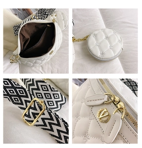 Detailansicht der weißen Stepptasche mit Sternstickerei und breitem Webgurt-Detail