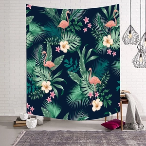 Macro detail of tropical tapestry with pink flamingos on a white brick wall background