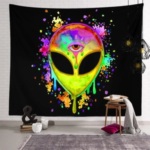 Detail of psychedelic alien tapestry with trippy neon drip art on a white brick wall