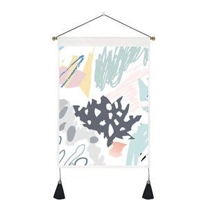 Detail of modern abstract tapestry featuring fabric texture, wooden pole, and black tassels