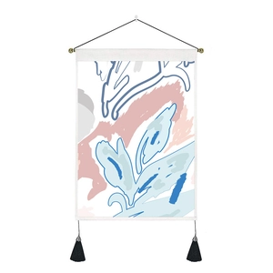 Detail of abstract floral tapestry with soft tones, wooden pole and black tassels