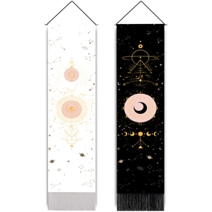 Black and white moon phase bohemian tapestries with celestial symbols and fringe tassels