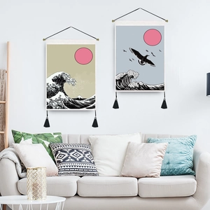 Japanese Great Wave tapestry with red sun and tassels in a modern living room setting