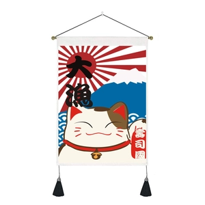 Close-up of Japanese Lucky Cat wall hanging with canvas texture and black tassels