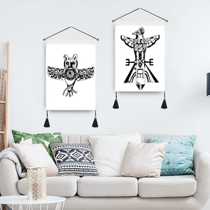 Set of two black and white Bohemian wall tapestries with bird patterns and tassels