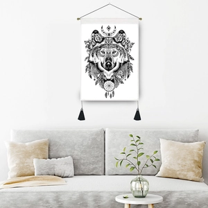 Bohemian wolf head tapestry with moon and feathers hanging in a modern living room