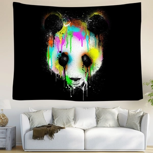 Colorful graffiti panda tapestry on black background hanging in a modern living room