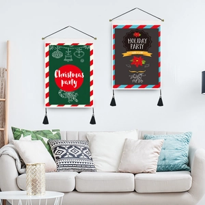 Cartoon Christmas wall tapestries with tassels and hanging cords in a cozy living room