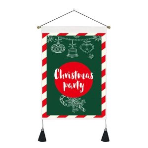 Detail of Christmas Party wall banner with green fabric, hanging rod and black tassels