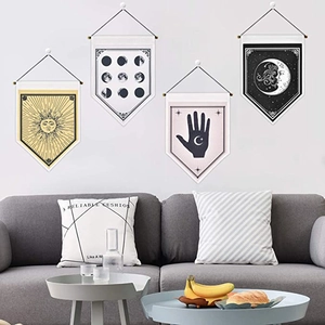 Detail of four-piece tarot style wall banners with sun and moon patterns in living room