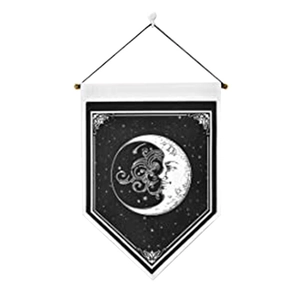 Detail of bohemian triangle tapestry with sun and moon pattern on white fabric