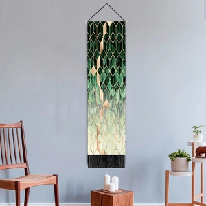 Modern wall tapestry with geometric green leaf patterns and black tassels for living room decor