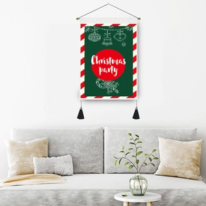 Christmas party tapestry with wooden rod and black tassels on a minimalist white wall