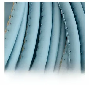 Macro detail of light blue woven leather texture and premium stitching on shoulder bag