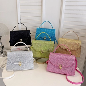 Glitter crossbody bags in six vibrant colors with elegant gold oval twist locks