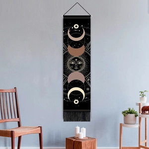 Bohemian sun and moon phase wall tapestry with black tassels and wooden hanging rod