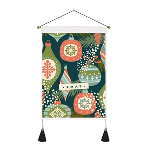 Close-up of Christmas wall tapestry with XMAS lettering and vintage ornament pattern